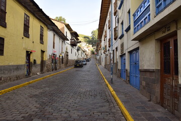 Fototapeta premium Cusco street with beautiful ancient architecture. Cobbled street of the old city of Cusco