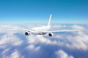 Aircraft flies motion effect high in the sky over the clouds, traveling in the celestial expanse.