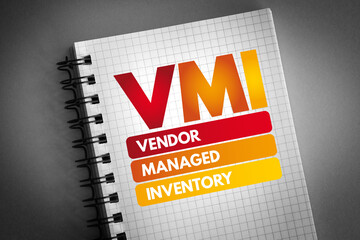 VMI - Vendor Managed Inventory acronym on notepad, business concept background