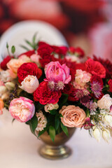 Beautiful bouquet of flowers in vase on the table