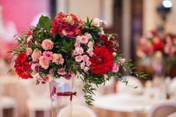 Beautiful bouquet of flowers in vase on the table