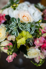 Beautiful bouquet of flowers in vase on the table
