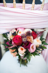 Beautiful wedding bouquet on the white chair
