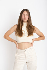 Young Woman dressing white on photo studio shooting - Confidence