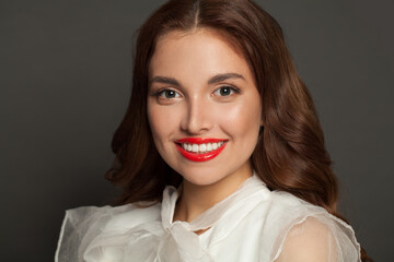 Beautiful woman face with cute toothy smile, close up portrait