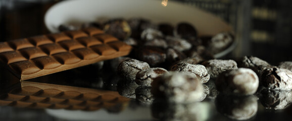 Chocolate chip cookies on a glass table on a white plate scattered in close-up. High quality photo