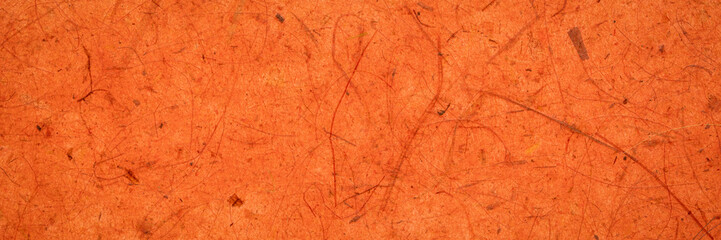 background of amber and orange backlit, handmade, mulberry paper with leaf and fine inclusions,...