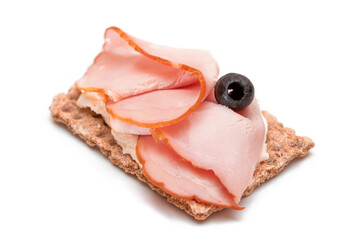 Whole Grain Crispbread with Ham, Cream Cheese and Olives - Isolated on White. Easy Breakfast. Diet Food. Quick and Healthy Sandwiches. Crispbread with Tasty Filling. Healthy Dietary Snack - Isolation