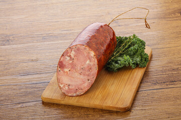 Pork ham sausage over board