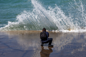 photographer capturing waves up close