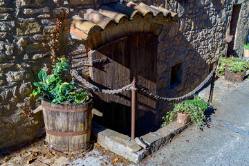 Old wooden door to access a rural house in a village