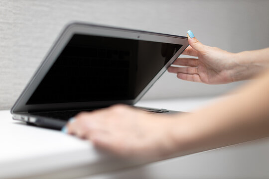 Woman Closes Laptop Lid With Her Hands