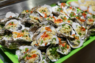 Grilled oysters in Chinese cuisine along with coconut.