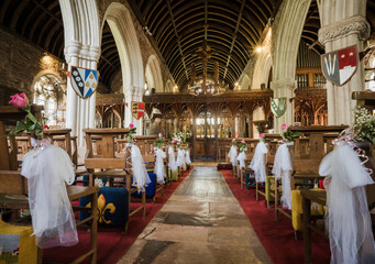 Fototapeta na wymiar Cockington Church, Devon Decorated For A Wedding With Flowers 