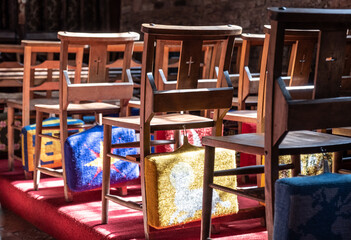 Embroided Prayer Cushions On The Back Of Wooden Chairs At Cockington Court Church, Devon