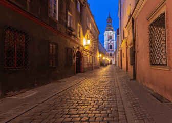 Fototapeta na wymiar Poznan. Old traditional narrow city street at sunrise.