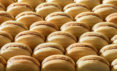 Homemade nut cookies with condensed milk cream filling.