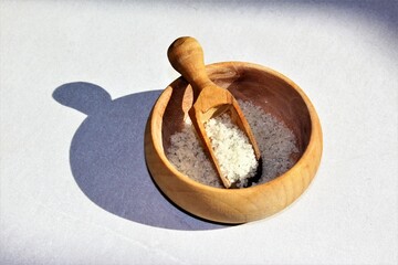 wooden bowl of salt with scooper