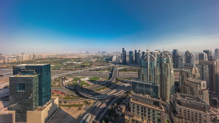 Fototapeta na wymiar Dubai marina and JLT skyscrapers along Sheikh Zayed Road aerial timelapse.