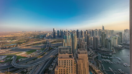 Naklejka na ściany i meble Dubai marina and JLT skyscrapers along Sheikh Zayed Road aerial timelapse.