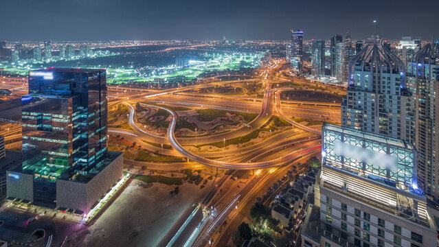 Huge highway crossroad junction between JLT district and Dubai Marina night timelapse. © neiezhmakov