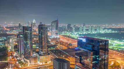 Aerial view of media city and al barsha heights district area night timelapse from Dubai marina.