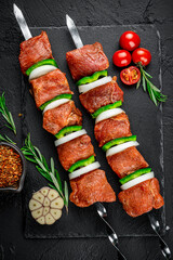 Raw kebab with vegetables. Raw shashlyk
