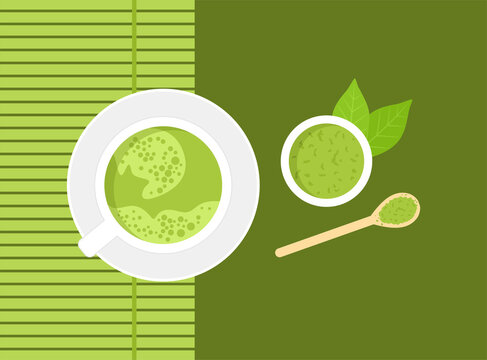 Japanese green matcha tea in a cup, powder in a saucer, bamboo spoon and bamboo mat on green background. Top view
