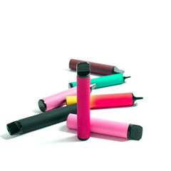 Set of colorful disposable electronic cigarettes on a white background. The concept of modern smoking, vaping and nicotine.