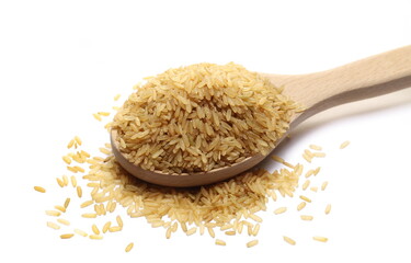 Integral uncooked rice pile in wooden spoon isolated on white  