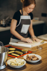 confectioner prepares dough for sweet in a modern kitchen
