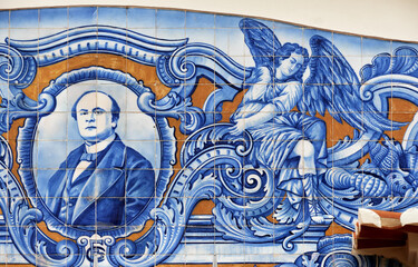 detail on a panel of azulejos tiles on the facade of old railways station in Aveiro, Portugal	
