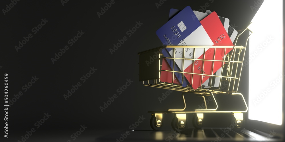 Poster credit card mockups with flags of france in a small shopping cart on the laptop. 3d rendering