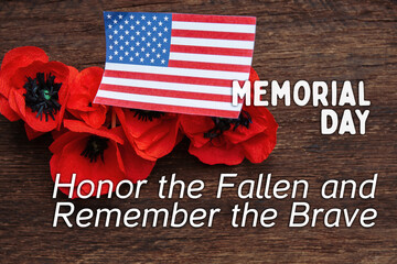 Fototapeta na wymiar Text Memorial Day on American flag And a poppy flower background 