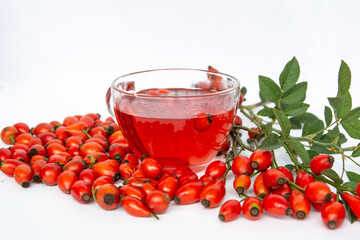 herbal tea cup Dog rose, bunch branch Rosehips, types Rosa canina hips, dry  tea leaves . Medicinal...