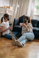 mother and daughter with cosmetic masks applied having time together at home