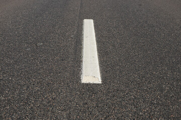 Asphalt road with single solid white line road marking