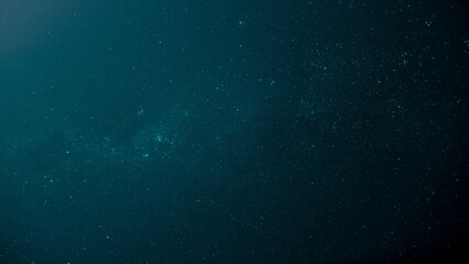 Naklejka na ściany i meble Low-angle shot of a starry night blue sky