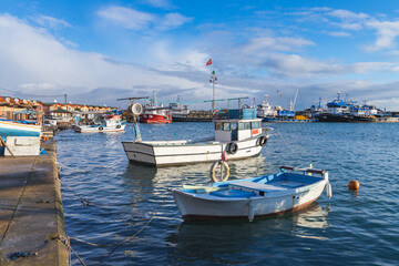 Fototapeta na wymiar Small fishing boats moored in harbor of Arakli, Trabzon, Turkey