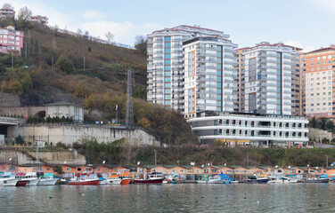 Fototapeta na wymiar Arakli harbor, Trabzon, Turkey. Coastal view with modern buildings