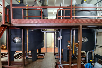 Metal tanks for making alcohol drinks in light workshop