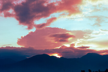Fototapeta na wymiar Beautiful sunset in rural Guatemala, mountains and volcano on the road.
