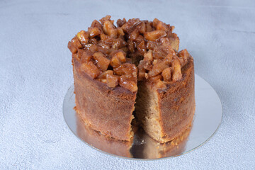 Banana cake and pieces of caramelized apple and vanilla cream