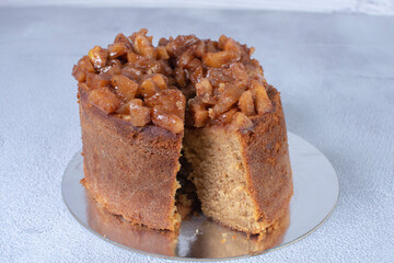Banana cake and pieces of caramelized apple and vanilla cream