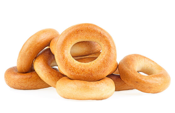 Delicious bread rings isolated on a white background. Pile of fresh bagels.