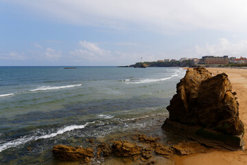Beautiful beach in Biarritz city with the lighthouse in the background. Summer time on the Basque...