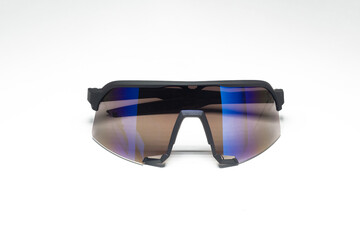 Sports sunglasses with blue reflection on white background