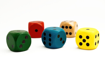 Colored dice on white background. Copy space.