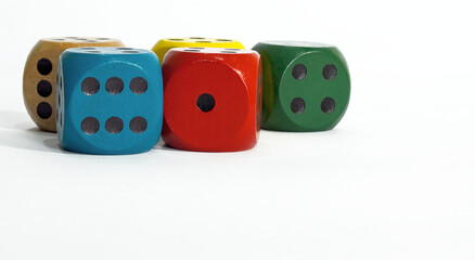 Colored dice on white background. Copy space.