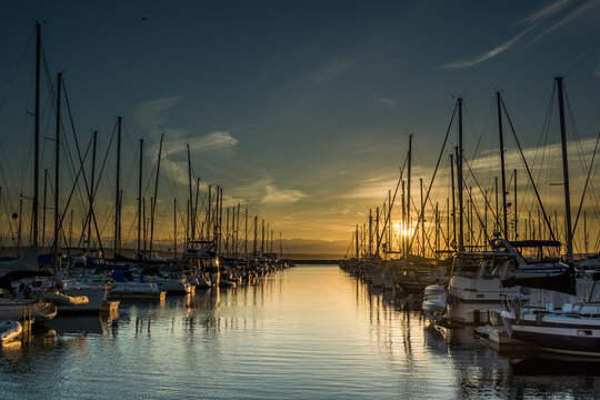 Sunset over ships moored at Shilshole Bay Marina, Ballard, Seattle, Washington